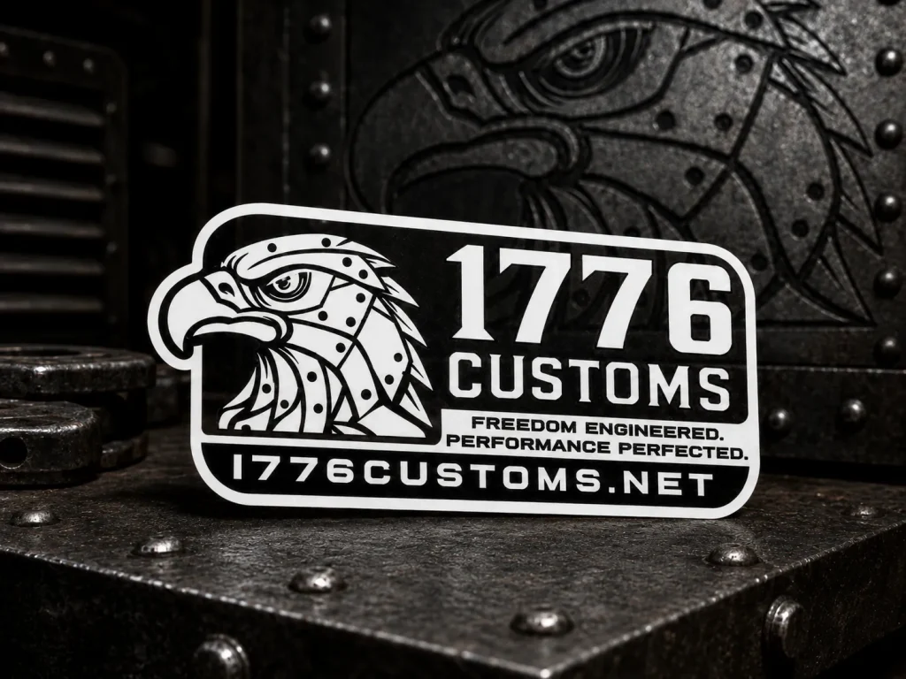 Male model showcasing the front and back of a 1776 Customs black performance polo shirt featuring dark grey side-blocker panels, a white eagle chest logo, a sleeve US flag emblem, and slogan text across the back shoulders.